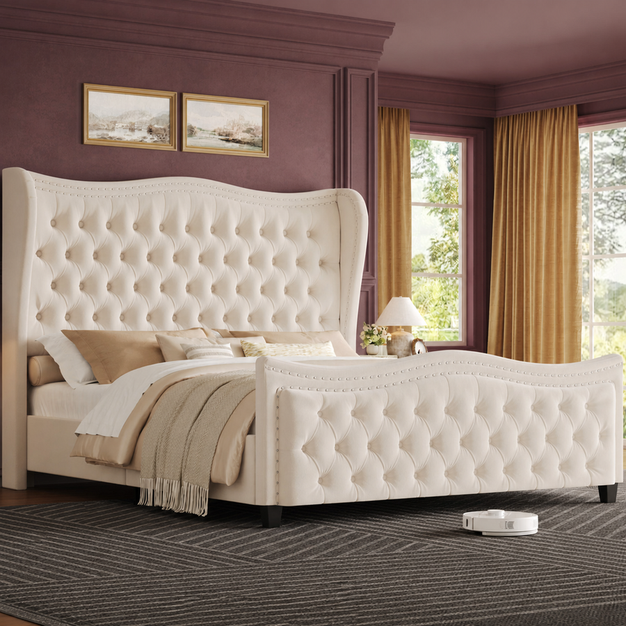 Angled room | Cream velvet wingback bed against dusty-plum walls with ochre curtains and a charcoal geometric rug