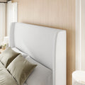 Headboard detail | Close view of the white fine-weave upholstery and wing profile