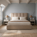Room 3 | Front view of the beige five-channel upholstered bed in a blue-gray beamed bedroom