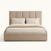Studio front | Straight-on studio view of the beige five-channel upholstered bed with its low matching footboard