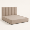 Studio three-quarter | Angled studio view of the beige five-channel upholstered bed with its low plinth base and side rail