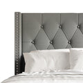 Headboard detail | Light Gray diamond tufting and nailhead wing trim