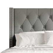 Headboard detail | Light Gray diamond tufting and nailhead wing trim