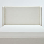 Headboard detail | Straight-on view of the ivory canvas weave and squared wings