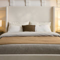 Headboard close view | Ivory canvas wings framing layered pillows