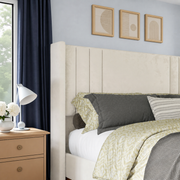 Cool blue bedroom close-up | Cream velvet channel headboard with navy curtains and pale oak wall art