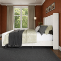 Terracotta bedroom angle | Cream velvet channel bed with flax curtains and a charcoal floor covering