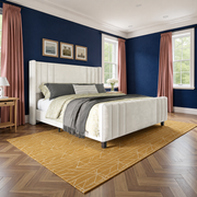 Cobalt bedroom | Cream velvet channel bed with smoky rose curtains and a saffron geometric rug