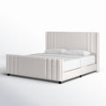 Studio angle | Cream velvet channel tufted bed from the front left on a white seamless background