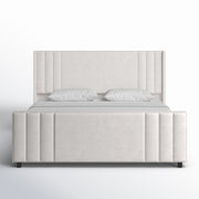Studio front | Straight-on cream velvet channel tufted bed on a white seamless background