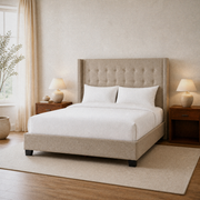 Warm bedroom angle | Beige linen wingback bed from a front-right room view