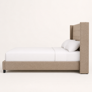Studio side | Right-side profile showing the tall wing and low upholstered rail