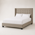 Studio angle | Front-right view showing the wing depth, upholstered rail, footboard, and dark feet