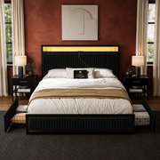 Oxide-red bedroom | Black velvet LED platform bed with both rolling drawers open