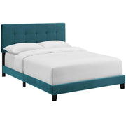 Grevane Scarp tufted platform bed in Sea Blue, three-quarter studio view