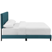 Grevane Scarp tufted platform bed in Sea Blue, side studio view