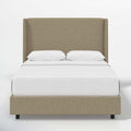 Studio front | Natural textured linen wingback bed with a continuous headboard and low footboard