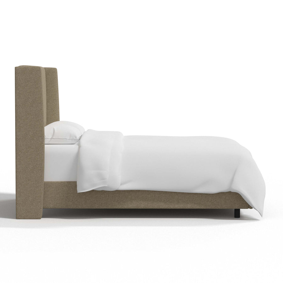 Studio side | Right profile of the natural linen wingback headboard, rail and dark feet