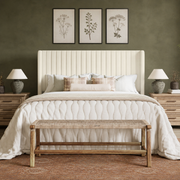 Olive bedroom | cream velvet channel wingback bed against deep olive walls