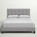 Front | Glacier gray tufted platform bed shown straight on with white bedding