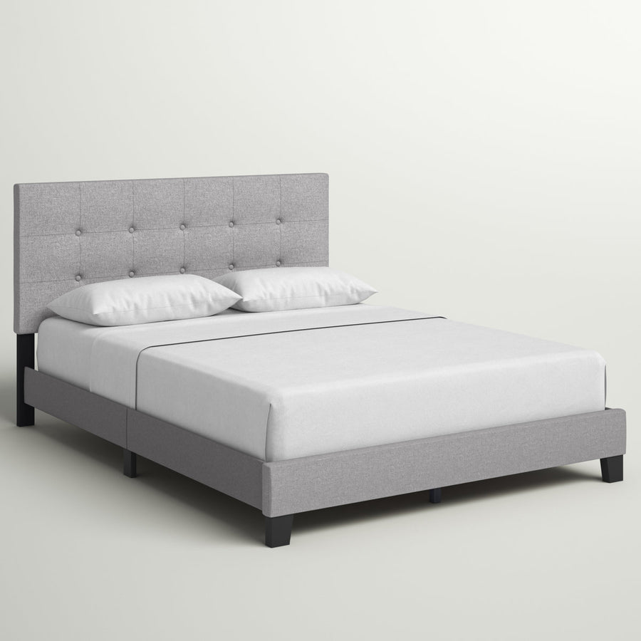 Studio angle | Front-right view of the Glacier gray tufted bed with white bedding