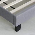 Footboard detail | Glacier gray upholstery, corner seam, leg, and wood slats