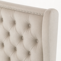 Nailhead detail | silver nailhead trim along cream velvet camelback wing