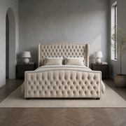 Blue-gray bedroom | cream velvet tufted wingback bed with dark nightstands