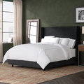 Room view | Black velvet wingback bed in a deep moss bedroom