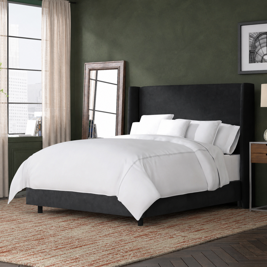 Room view | Black velvet wingback bed in a deep moss bedroom