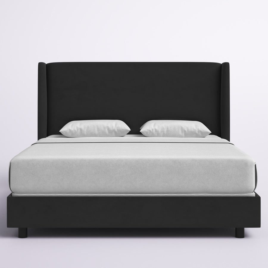 Studio front | Black velvet wingback bed with white bedding