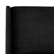 Headboard detail | Close view of the black velvet headboard and wing