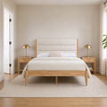 In scale | cream boucle and natural wood bed beside a full interior doorway