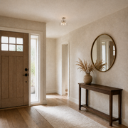 In the entryway | the same flush mount hanging near a console and mirror