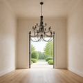 Scale | black chandelier hanging in front of a full-height open doorway for a clear size reference