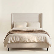 Grevane Haven Upholstered Wingback Bed - front view on white
