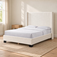 White boucle queen wingback bed in a bedroom