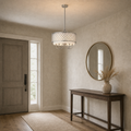 In a room | brushed-nickel quatrefoil drum chandelier hanging in an entryway