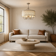 In a room | brushed-nickel quatrefoil drum chandelier hanging in a living room