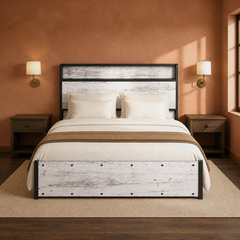 Room 3 | Front view of the bed in a softly lit bedroom with wall sconces and bedside tables