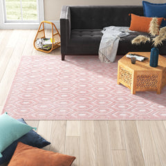 Indoor and Outdoor Area Rug in Pink with Textured Geometric Pattern
