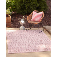 Indoor and Outdoor Area Rug in Pink with Textured Geometric Pattern