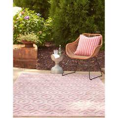 Indoor and Outdoor Area Rug in Pink with Textured Geometric Pattern