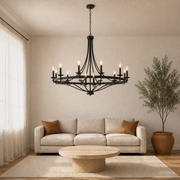 Living room | the wagon-wheel chandelier over a coffee table