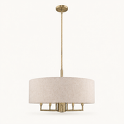 Front | studio front of the beige linen-blend drum and brass rod