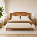 Room two | Straight-on headboard in a light room with a fiddle leaf fig, round ceramic lamps, and oak-tone nightstands