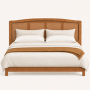 Front | Straight-on studio plate of the whole headboard on a pale backdrop, showing the arched top and cane weave