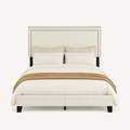 Front | Straight-on studio view of the whole upholstered bed with double-row nailhead trim