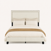 Front | Straight-on studio view of the whole upholstered bed with double-row nailhead trim