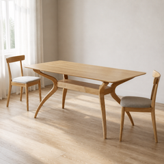 Angle | same dining room, table at a true three-quarter so the curved legs and stretcher both read